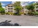 Apartment building featuring multiple stories with balconies and well-maintained landscaping around the property at 1250 Parkwood Se Cir # 1203, Atlanta, GA 30339