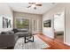 Inviting living room featuring a comfortable gray sectional, sleek coffee table, and a cozy rug, perfect for relaxation at 1250 Parkwood Se Cir # 1203, Atlanta, GA 30339