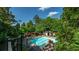 Relaxing pool area surrounded by lush trees offering a private and tranquil community space at 1250 Parkwood Se Cir # 1203, Atlanta, GA 30339