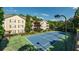 A view of the tennis court with buildings in the background at 1250 Parkwood Se Cir # 1203, Atlanta, GA 30339