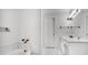 Bright bathroom featuring white walls, marble tile, and modern fixtures at 249 Sycamore Pl, Decatur, GA 30030