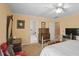 Bright bedroom with a ceiling fan, ensuite bathroom, and antique furniture at 249 Sycamore Pl, Decatur, GA 30030
