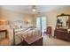 Bedroom with an antique-style bed frame, wooden furniture, and natural light at 249 Sycamore Pl, Decatur, GA 30030