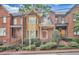 Charming brick townhome with meticulously landscaped front yard and welcoming entrances to all units at 249 Sycamore Pl, Decatur, GA 30030