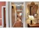 Hallway with hardwood floors leading to a naturally lit living space at 249 Sycamore Pl, Decatur, GA 30030