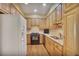 Well-lit kitchen with granite counters, stainless steel appliances, and wood cabinetry at 249 Sycamore Pl, Decatur, GA 30030