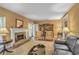 Bright living room with hardwood floors, fireplace, and built-in bookcases for ample storage at 249 Sycamore Pl, Decatur, GA 30030
