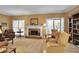 Inviting living room with fireplace, hardwood floors, and access to outdoor space at 249 Sycamore Pl, Decatur, GA 30030