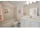 Cozy bathroom featuring a combination shower/tub, marble countertops and a modern vanity at 304 Meadowbrook Ne Dr, Atlanta, GA 30342