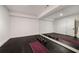 Home gym with mirrored wall, rubber flooring, weights, and workout mats at 304 Meadowbrook Ne Dr, Atlanta, GA 30342