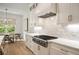 Bright, well-equipped kitchen featuring stainless steel appliances, custom cabinets and stone countertops at 304 Meadowbrook Ne Dr, Atlanta, GA 30342