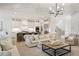 Spacious open living area with views of the modern kitchen, staircase, and gorgeous modern details at 304 Meadowbrook Ne Dr, Atlanta, GA 30342