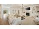 Bright living room with fireplace, built-in shelving, hardwood floors, neutral tones, and comfortable seating at 304 Meadowbrook Ne Dr, Atlanta, GA 30342