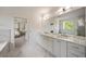Bright main bathroom features dual vanities, marble countertops, and a view to the main bedroom at 304 Meadowbrook Ne Dr, Atlanta, GA 30342