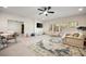 Spacious recreation room with neutral carpet, TV, seating, and large windows at 304 Meadowbrook Ne Dr, Atlanta, GA 30342