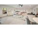 Large recreation room with neutral carpet, seating areas, and natural light at 304 Meadowbrook Ne Dr, Atlanta, GA 30342