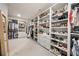 Expansive walk-in closet provides ample storage with built-in shelving and hanging racks at 304 Meadowbrook Ne Dr, Atlanta, GA 30342