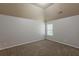 This bedroom features neutral paint, and a window with natural light at 3912 Margaux Dr, Atlanta, GA 30349