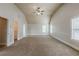 Spacious carpeted bedroom with vaulted ceilings and neutral tones at 3912 Margaux Dr, Atlanta, GA 30349
