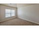 This bedroom features neutral paint, and a window with natural light at 3912 Margaux Dr, Atlanta, GA 30349