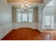 Dining room with bay window, hardwood floors, chandelier, and neutral paint at 3912 Margaux Dr, Atlanta, GA 30349