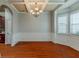 Dining room with hardwood floors, coffered ceilings, and paneled walls at 3912 Margaux Dr, Atlanta, GA 30349