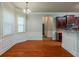 Bright dining area with large windows and wood flooring, adjacent to the kitchen at 3912 Margaux Dr, Atlanta, GA 30349