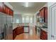 Well-equipped kitchen with stainless steel appliances and granite countertops, adjacent to a bright dining area at 3912 Margaux Dr, Atlanta, GA 30349