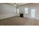 Spacious living room with a fireplace, carpeted floors, and natural light at 3912 Margaux Dr, Atlanta, GA 30349