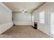 Spacious living room with a fireplace and decorative paneling, offering a cozy atmosphere at 3912 Margaux Dr, Atlanta, GA 30349