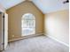 Bedroom featuring neutral tones, carpet flooring, and a large window for ample natural light at 5246 Salem Springs Pl, Lithonia, GA 30038