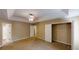 Expansive bedroom showcasing neutral walls, carpeted floors, and walk-in closet at 5246 Salem Springs Pl, Lithonia, GA 30038