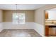 Inviting dining area with tiled floors and natural light at 5246 Salem Springs Pl, Lithonia, GA 30038