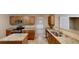 Well-lit kitchen features stainless steel appliances, granite countertops, and light brown wooden cabinets at 5246 Salem Springs Pl, Lithonia, GA 30038