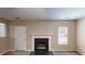 Living room showcasing a fireplace and natural light from a window at 5246 Salem Springs Pl, Lithonia, GA 30038