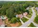 An aerial view of a suburban community features tree-lined streets and well-maintained homes at 825 Yosemite Dr, Suwanee, GA 30024