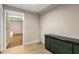 Basement hallway with laminate flooring, neutral walls and an exit door at 825 Yosemite Dr, Suwanee, GA 30024