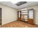 A bonus room features vinyl wood floors, shelving, and mini split AC unit at 825 Yosemite Dr, Suwanee, GA 30024