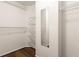 A walk in closet with wire shelving and a full length mirror for ample clothing storage at 825 Yosemite Dr, Suwanee, GA 30024