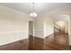 Elegant dining room features hardwood floors, chair rail, and a modern chandelier at 825 Yosemite Dr, Suwanee, GA 30024