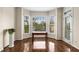 Charming dining area with hardwood floors, a bright bay window, and a stylish table setting at 825 Yosemite Dr, Suwanee, GA 30024