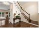 Elegant foyer showcasing hardwood floors, staircase, and a bright entryway with natural light at 825 Yosemite Dr, Suwanee, GA 30024