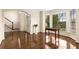 Open-concept living area with gleaming hardwood floors, large windows, and an inviting atmosphere at 825 Yosemite Dr, Suwanee, GA 30024