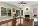 Bright living room features hardwood floors, a fireplace, and lots of natural light from the many windows at 825 Yosemite Dr, Suwanee, GA 30024