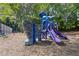 Community playground with climbing wall, swings and slides at 825 Yosemite Dr, Suwanee, GA 30024