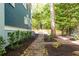 Picturesque backyard featuring a brick pathway, a stone bench, and well-maintained landscaping at 118 Waverly Way, Atlanta, GA 30307