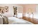 Light-filled bedroom featuring decor, hardwood floors, a comfortable bed, and closet at 118 Waverly Way, Atlanta, GA 30307