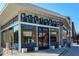 Modern commercial building featuring large glass windows and unique signage. Close to public transportation and pedestrian friendly at 118 Waverly Way, Atlanta, GA 30307