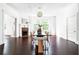 Dining room with fireplace, hardwood floors and modern light fixture at 118 Waverly Way, Atlanta, GA 30307