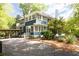 Stately two-story home with blue siding, a covered porch, and a well-manicured lawn at 118 Waverly Way, Atlanta, GA 30307